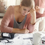 woman depressed look while managing finances